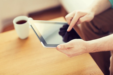 close up of man with laptop and cup at home