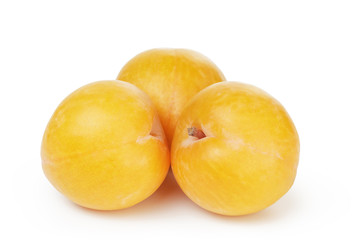 three ripe yellow plums
