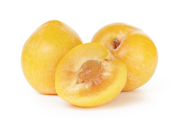 three ripe yellow plums