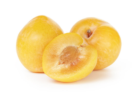 three ripe yellow plums