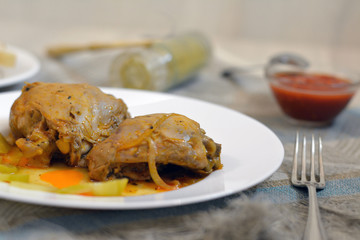 Chichen stewed in tomato gravy with tomato sauce