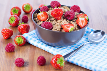 Bran flakes with fresh raspberries and strawberries