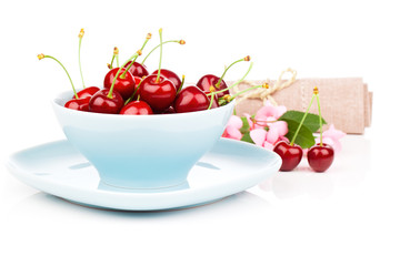 Bowl full of cherries isolated on white background