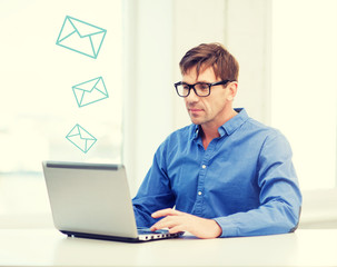 man working with laptop at home