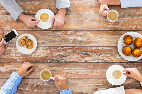 close up of business team drinking coffee on lunch - Powered by Adobe