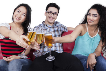 Teenagers having fun by drinking champagne