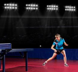 Girl table tennis player at sports hall