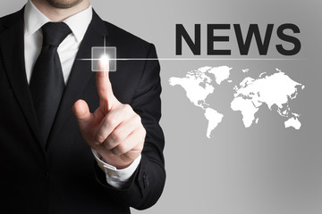 businessman pushing button news worldmap
