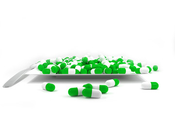 large pile of green colored pills on white plate
