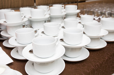 Catering - rows of cups served for tea table