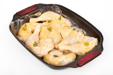 Fresh raw chicken legs in marinade