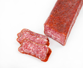 Slices italian salami sausage on white background