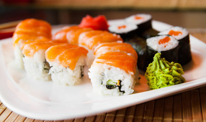 Roll with Cream Cheese and Cucumber inside. Salmon topped