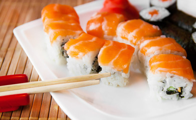 Roll with Cream Cheese and Cucumber inside. Salmon topped