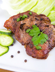 tasty grill meat with sauce and green on white plate