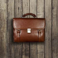 briefcase on a wooden shabby background
