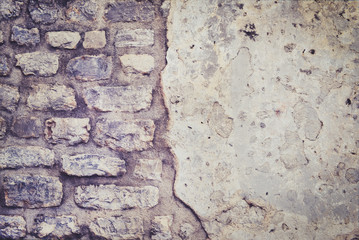 Old rough grey stone wall texture