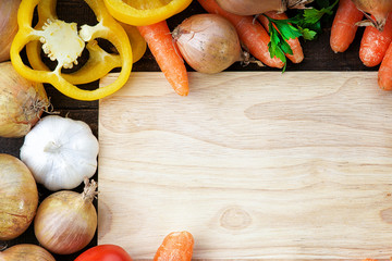Fresh vegetables mix and wooden cutting board