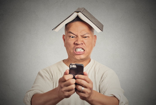 Stressed angry man poking at his smart phone