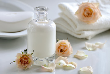 Fototapeta na wymiar Cosmetic milk, shampoo or lotion in glass bottle
