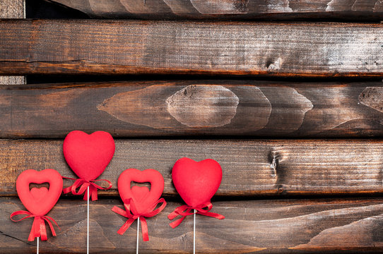 Four red hearts on sticks.