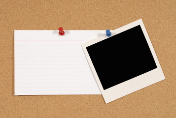 Polaroid style photo frame print with office index card pinned to a cork notice or bulletin board
