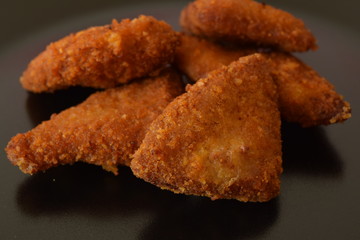 Plate of chicken nuggets with dip sauce.