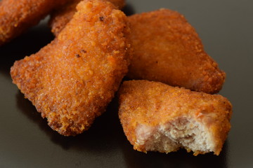 Plate of chicken nuggets with dip sauce.