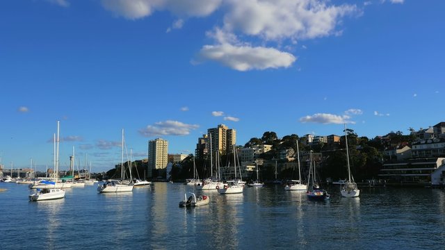 Panning shot of Lavender Bay and Sydney Harbor Bridge