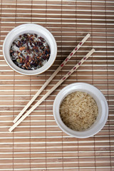 two slides rice and Chinese sticks on the Mat