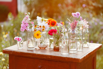 Obraz na płótnie Canvas nice flowers in the bottles