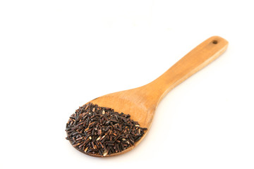 Black rice on wood Ladle