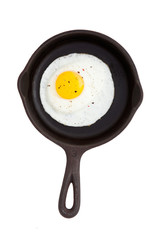 Cast iron frying pan with an egg