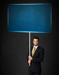Businessman with blue board