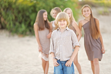 Portrait of children on the beach in summer