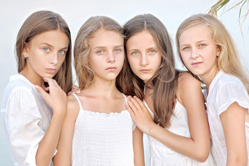 Portrait of children on the beach in summer