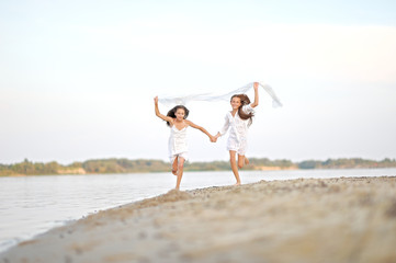 Portrait of two girls on the beach