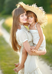 portrait of mother and daughter in nature