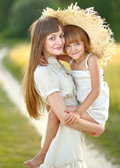 portrait of mother and daughter in nature