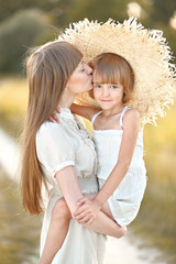 portrait of mother and daughter in nature