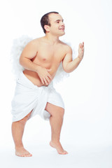 Little angel man posing with wings