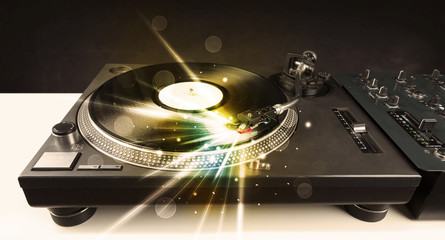 Music player playing vinyl with glow lines comming from the need
