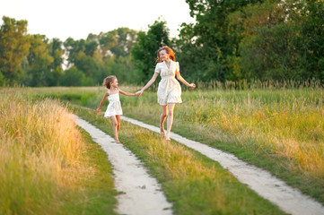 portrait of mother and daughter in nature