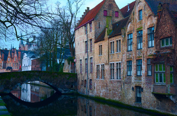 Fototapeta na wymiar Bruges' canals in the evening, Belgium. Toned image