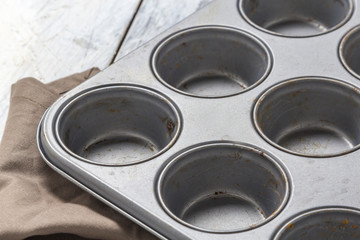 Muffin tray on wooden table