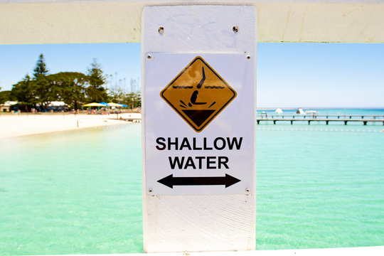 Shallow water sign on the beach