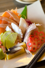 A colorful platter of sashimi sushi