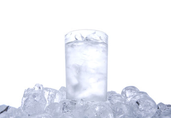A glass of iced water and ice cubes 