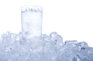 A glass of iced water and ice cubes 