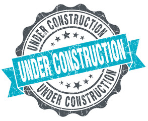 under construction vintage turquoise seal isolated on white